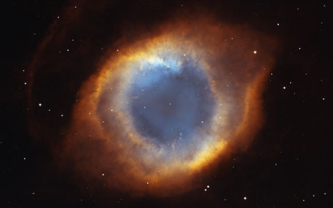 High-resolution desktop wallpaper The Helix Nebula's Iridescent Glory by NASA, NOAO, ESA, the Hubble Helix Nebula Team, M. Meixner (STScI), and T.A. Rector (NRAO)